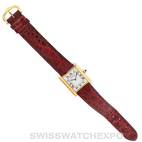 The image shows a top-down view of the Cartier Tank Classic 960655124 Men's Yellow Gold Silver Dial 960655124 Men's Yellow Gold Silver Dial watch, displaying its face, case, and strap.