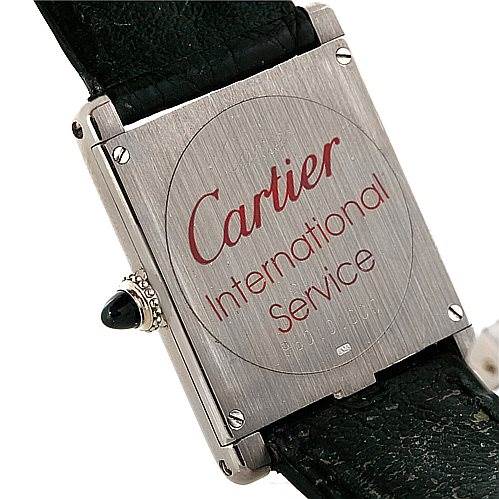 This image shows the back case and part of the strap of the Cartier Tank Classic Men's White Gold White Dial Men's White Gold White Dial watch.