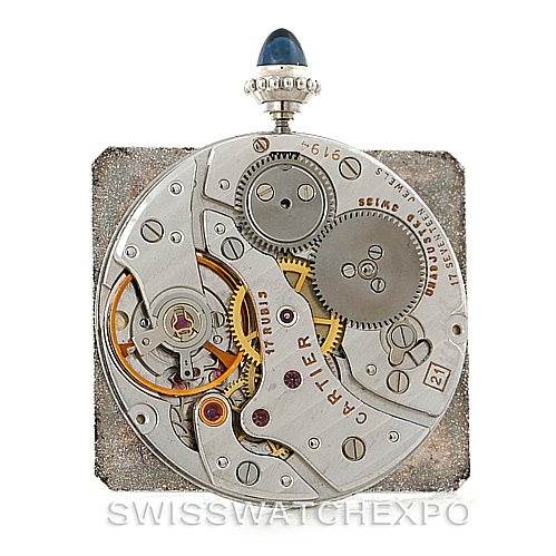 This image shows the internal movement mechanism of a Cartier Tank Classic Men's White Gold White Dial Men's White Gold White Dial watch from a top-down angle.