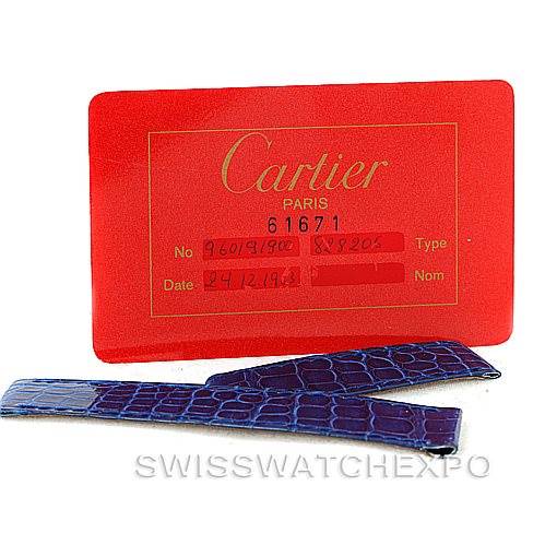 The image shows a red Cartier card and a pair of replacement blue leather straps for the Cartier Tank Classic Men's White Gold White Dial Men's White Gold White Dial model.