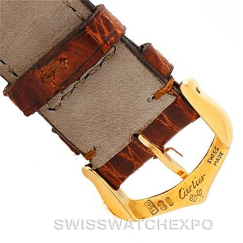 This image shows a close-up of the clasp and part of the leather strap of the Tank Classic model by Cartier.