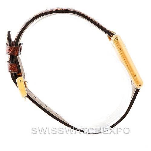 The image shows a side profile of the Cartier Tank Classic Men's Yellow Gold Silver Dial Men's Yellow Gold Silver Dial model watch, highlighting the strap and case.