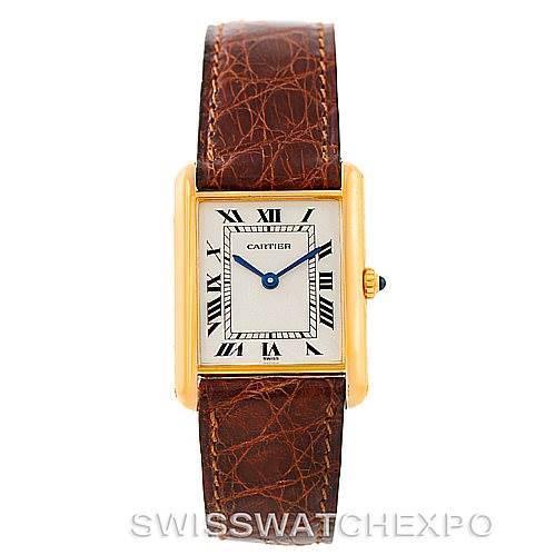 The image shows a front view of a Cartier Tank Classic Men's Yellow Gold Silver Dial Men's Yellow Gold Silver Dial watch, displaying the face, Roman numeral hour markers, and brown leather strap.