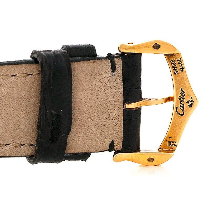 This image shows a close-up of the buckle and leather strap part of the Cartier Tank Classic Men's Yellow Gold White Dial Men's Yellow Gold White Dial watch.