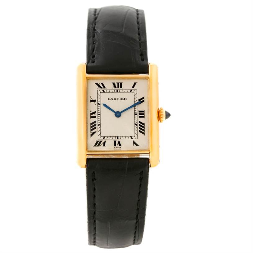The Cartier Tank Classic Men's Yellow Gold Beige Dial Men's Yellow Gold Beige Dial watch is shown from a front angle, displaying its face, black leather strap, and gold rectangular case.