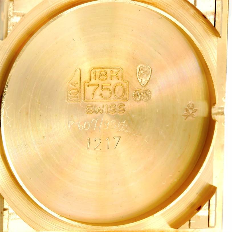 The image shows the case back interior of the Tank Classic model by Cartier, highlighting hallmarks and inscriptions.