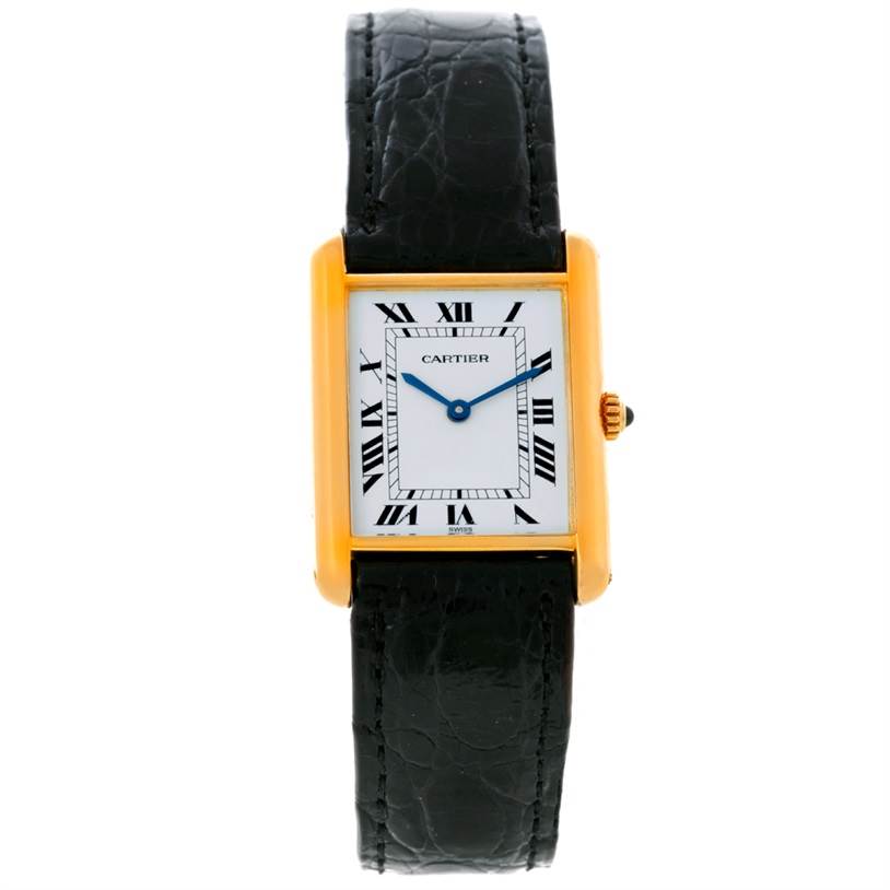 The image shows a frontal view of the Cartier Tank Classic Yellow Gold White Dial Yellow Gold White Dial watch, highlighting its rectangular face, Roman numerals, and black leather strap.