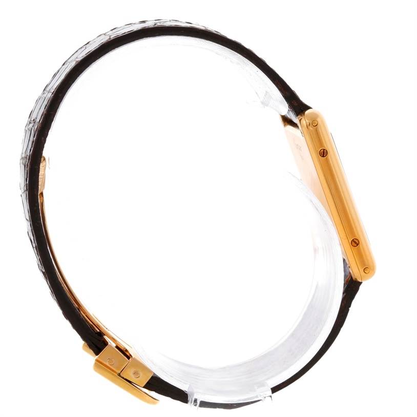 The image shows a side view of the Cartier Tank Classic 810521619 Yellow Gold White Dial 810521619 Yellow Gold White Dial watch, highlighting the case and part of the strap.