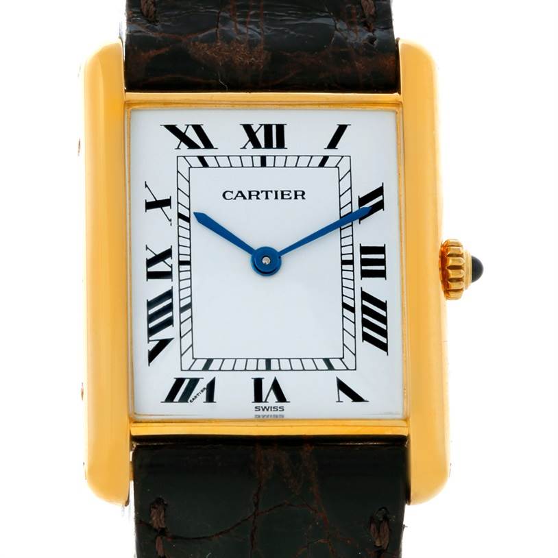 The image shows a frontal view of a Cartier Tank Classic 810521619 Yellow Gold White Dial 810521619 Yellow Gold White Dial watch, featuring its rectangular dial, Roman numerals, and leather strap.