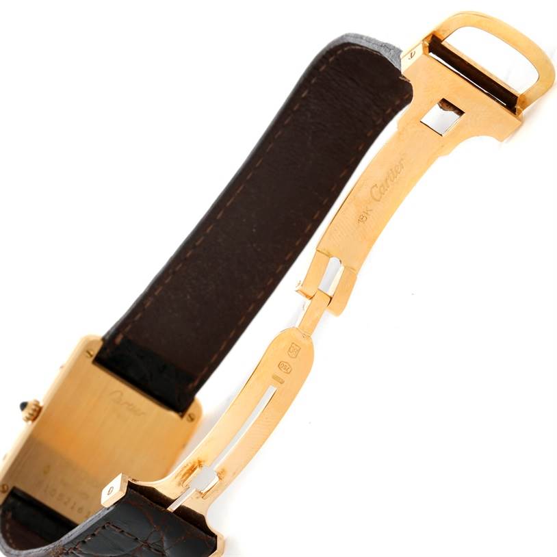 The image shows a side angle of the unfolded clasp and leather strap of the Cartier Tank Classic 810521619 Yellow Gold White Dial 810521619 Yellow Gold White Dial watch.
