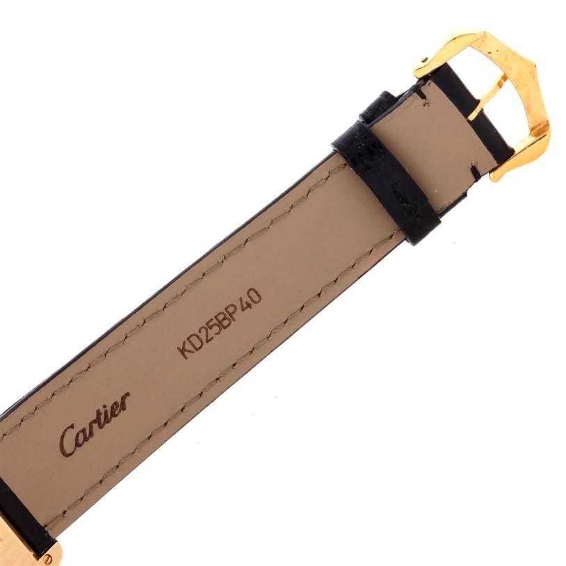 The image shows the underside of the strap and buckle of a Tank Classic model by Cartier.