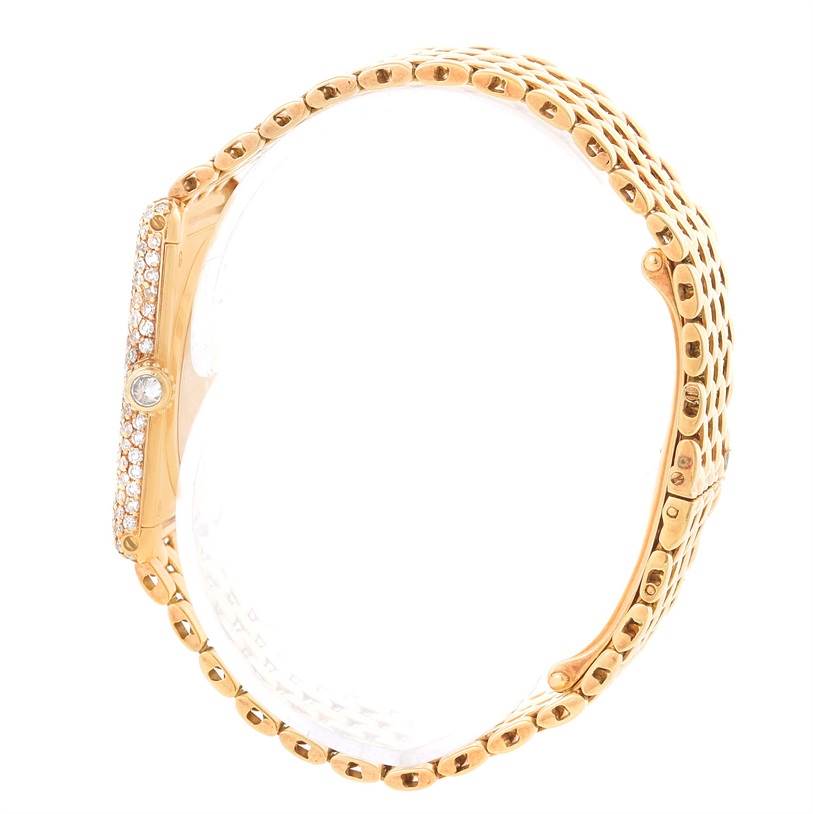 The image shows a side view of the Cartier Tank Classic Women's Yellow Gold Mother of Pearl Dial Women's Yellow Gold Mother of Pearl Dial watch, highlighting its gold bracelet and bejeweled case side.