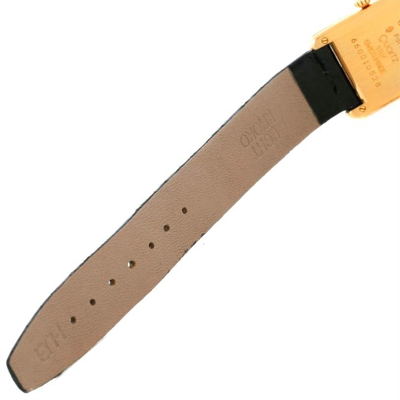 The image shows the back of the strap and the rear case of the Cartier Tank Classic Women's Yellow Gold White Dial Women's Yellow Gold White Dial watch.