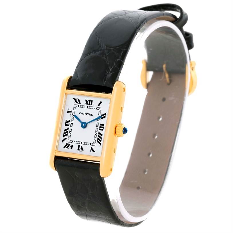 The image shows a Cartier Tank Classic Women's Yellow Gold White Dial Women's Yellow Gold White Dial watch from an angled side view, highlighting its face, strap, and crown.