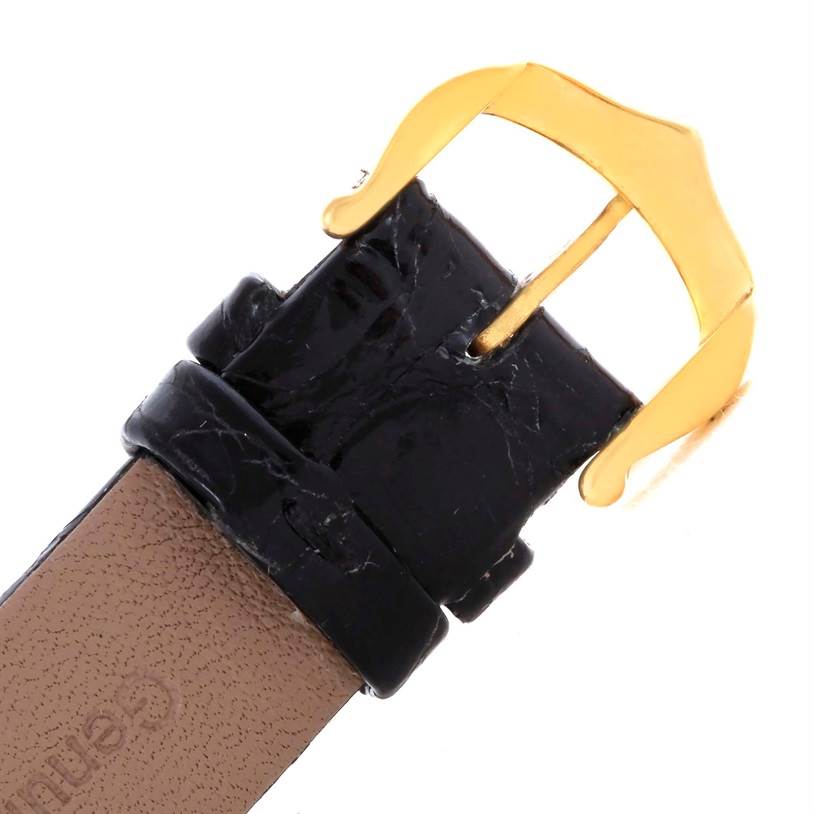 The image shows a close-up view of the buckle and strap of a Tank Classic watch by Cartier.