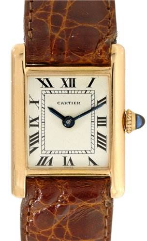 The image shows a front view of a Cartier Tank Classic Women's Yellow Gold White Dial Women's Yellow Gold White Dial watch, displaying its face, Roman numerals, and brown leather strap.