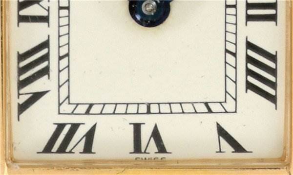 The image shows a close-up of the face of a Cartier Tank Classic Women's Yellow Gold White Dial Women's Yellow Gold White Dial watch, highlighting its Roman numeral markers and "Swiss" label.