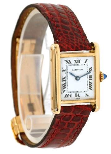 This image shows the Cartier Tank Classic Women's Yellow Gold White Dial Women's Yellow Gold White Dial watch at an angled side view, highlighting its face, gold case, and red leather strap.