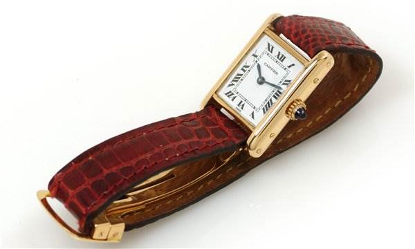 The Cartier Tank Classic Women's Yellow Gold White Dial Women's Yellow Gold White Dial watch is shown from a slight side angle, displaying the dial, case, strap, and buckle.