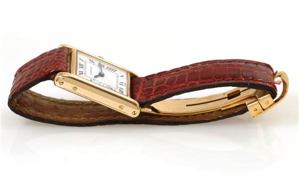 The image shows a Cartier Tank Classic Women's Yellow Gold White Dial Women's Yellow Gold White Dial watch from a side angle, highlighting the face, strap, and buckle.