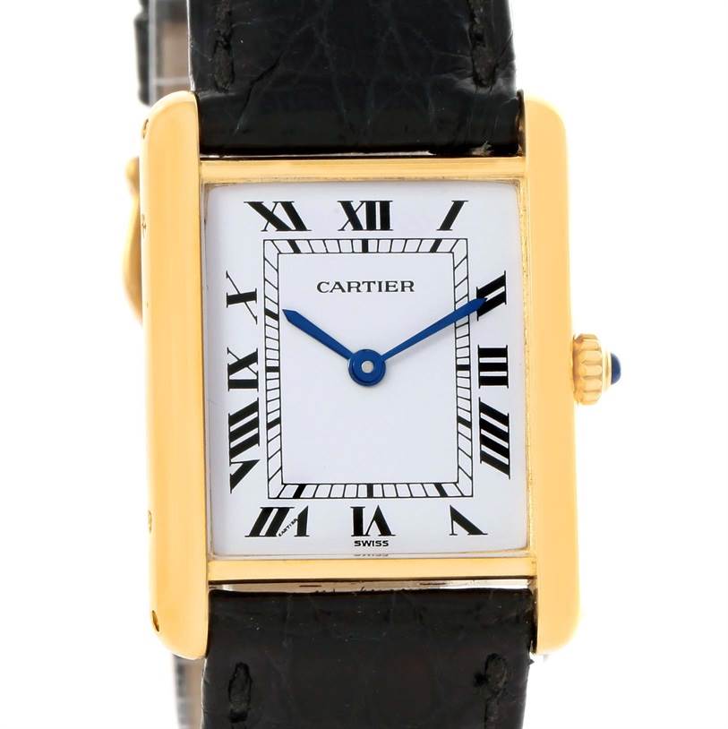 The image shows a front view of the Cartier Tank Classic Yellow Gold White Dial Yellow Gold White Dial watch, detailing its rectangular face, Roman numerals, and leather strap.