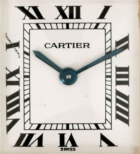 The image shows a close-up of the Cartier Tank Classic Women's Yellow Gold White Dial Women's Yellow Gold White Dial watch face featuring Roman numerals and the brand name prominently.