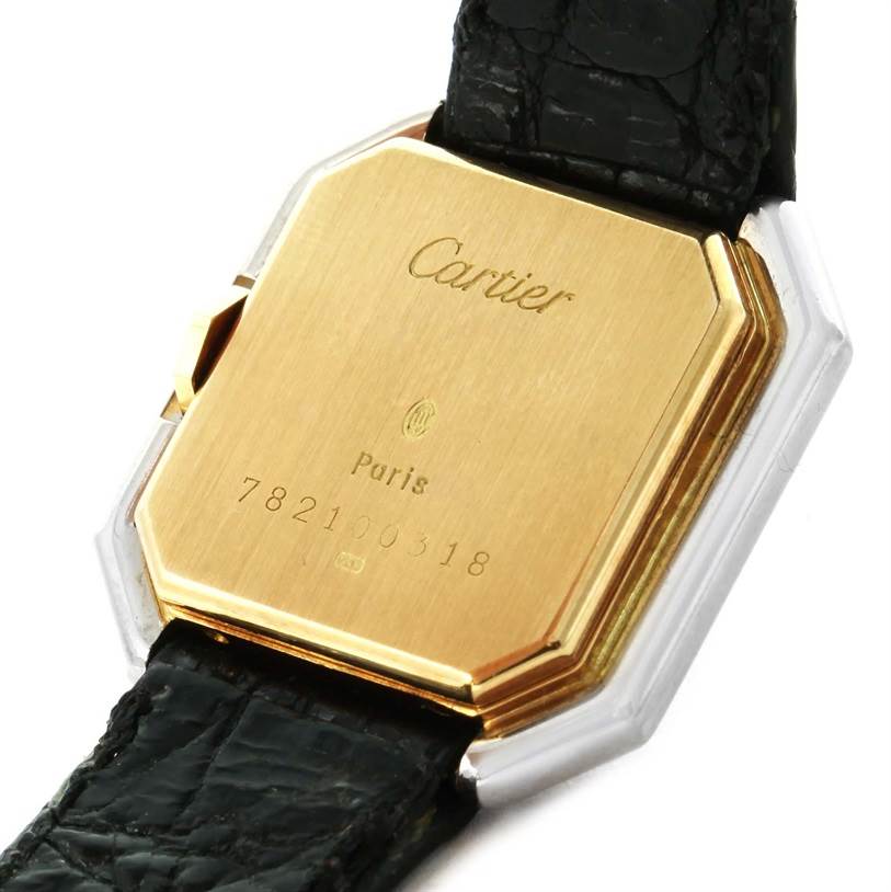 This image shows the back of the Cartier Tank Classic Women's Yellow Gold White Dial Women's Yellow Gold White Dial watch with a gold-colored case and a black leather strap.