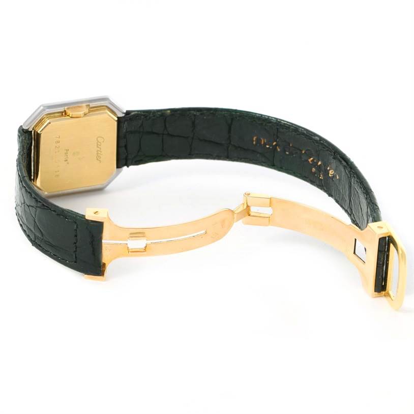The image shows the backside and clasp of a Cartier Tank Classic Women's Yellow Gold White Dial Women's Yellow Gold White Dial watch, highlighting the gold case and black leather strap.
