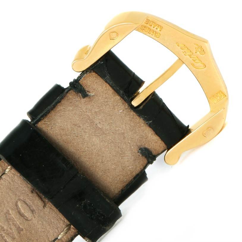 This image shows a close-up of the buckle and strap of a Cartier Tank Classic Women's Yellow Gold White Dial Women's Yellow Gold White Dial watch.