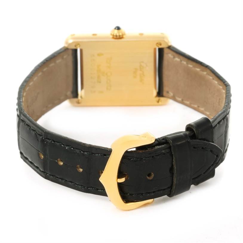 The image shows the back view of a Cartier Tank Classic Women's Yellow Gold White Dial Women's Yellow Gold White Dial watch, highlighting the strap and the backside of the case.