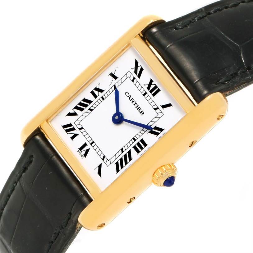 The image shows a Cartier Tank Classic Women's Yellow Gold White Dial Women's Yellow Gold White Dial watch at a slight angle, displaying its face, gold case, crown, and black leather strap.