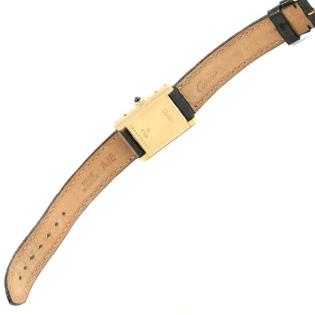 The image shows the back view of a Cartier Tank Classic Women's Yellow Gold White Dial Women's Yellow Gold White Dial watch, showcasing the strap and case back details.