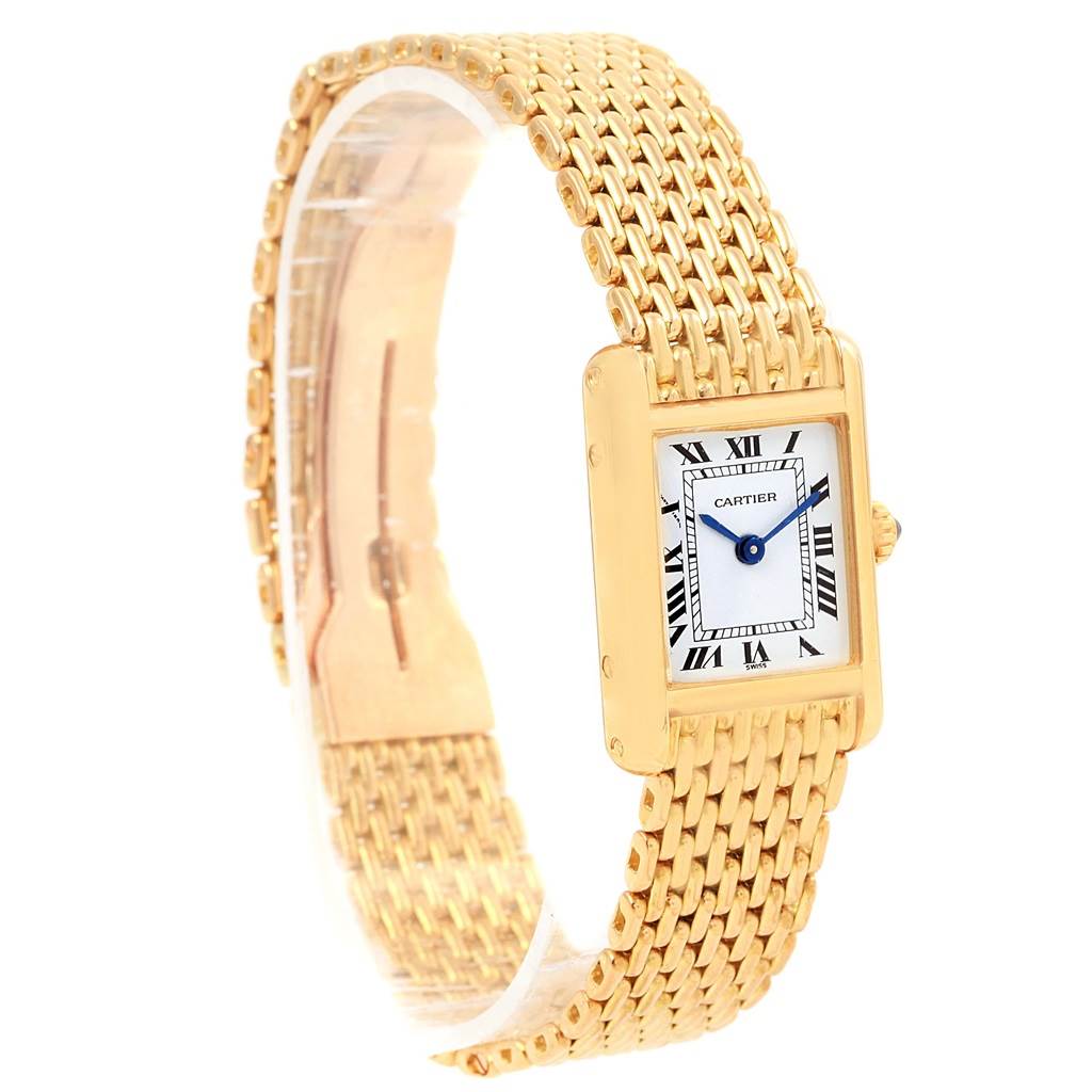 The image shows a Cartier Tank Classic Women's Yellow Gold White Dial Women's Yellow Gold White Dial model watch angled to display the face, bezel, and portion of the gold bracelet.