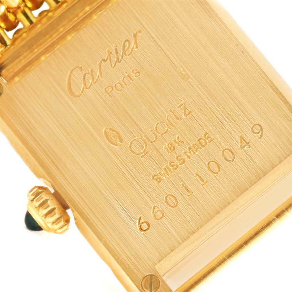 This image shows the back case and crown of a Cartier Tank Classic Women's Yellow Gold White Dial Women's Yellow Gold White Dial watch.
