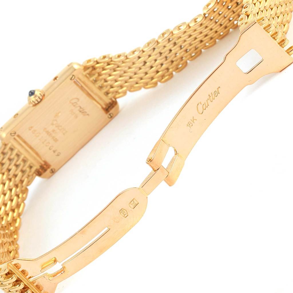The image shows the back view and clasp of the gold bracelet of a Cartier Tank Classic Women's Yellow Gold White Dial Women's Yellow Gold White Dial watch.