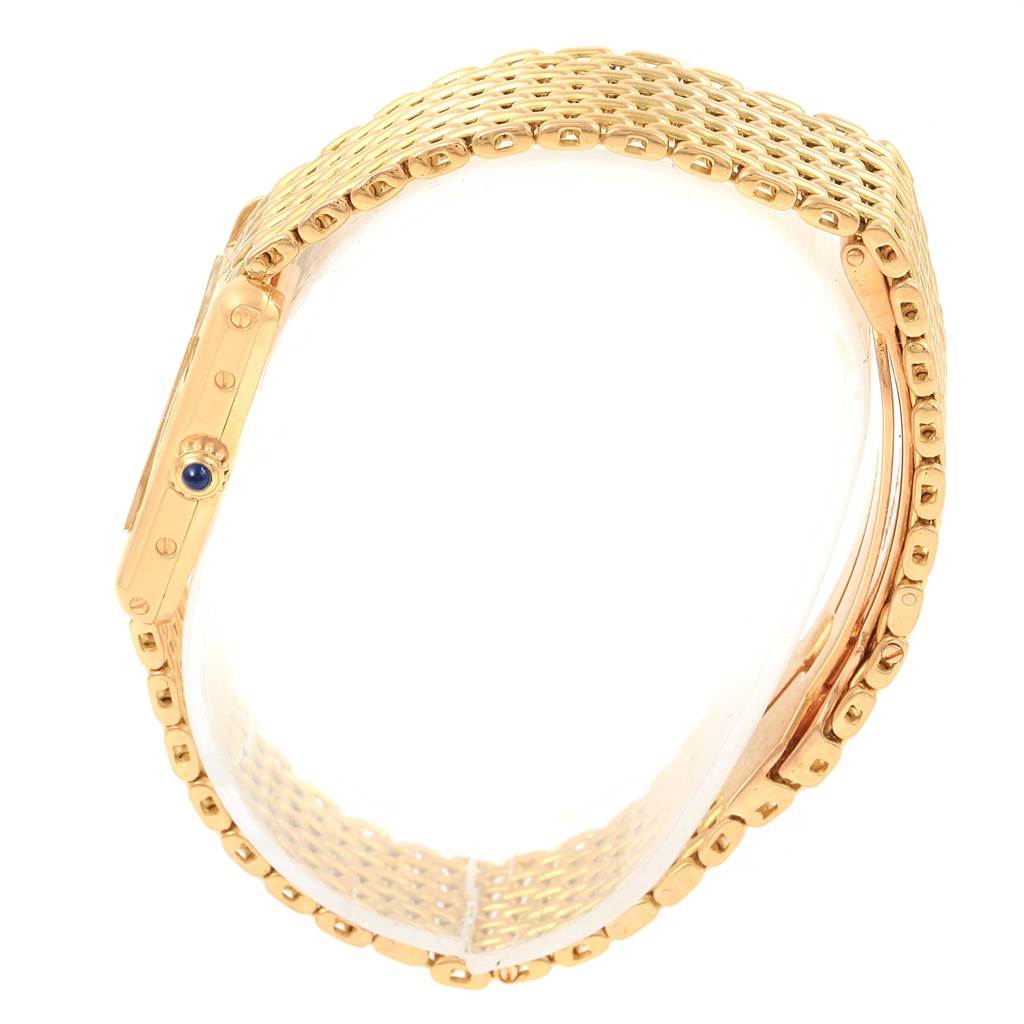 The image shows a side view of the Cartier Tank Classic Women's Yellow Gold White Dial Women's Yellow Gold White Dial watch, highlighting the gold bracelet and crown.