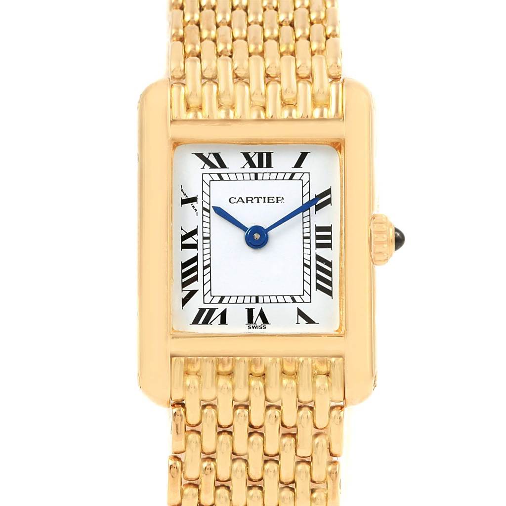 The image shows a front view of the Cartier Tank Classic Women's Yellow Gold White Dial Women's Yellow Gold White Dial watch, highlighting its gold rectangular case, bracelet, and dial.
