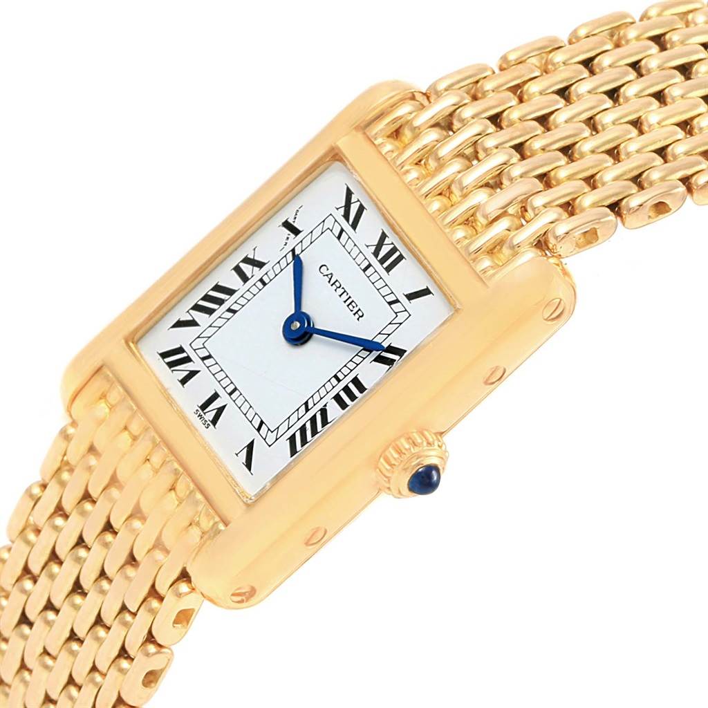 The image shows a Cartier Tank Classic Women's Yellow Gold White Dial Women's Yellow Gold White Dial watch at an angle, highlighting its rectangular face, gold casing, and linked gold bracelet.
