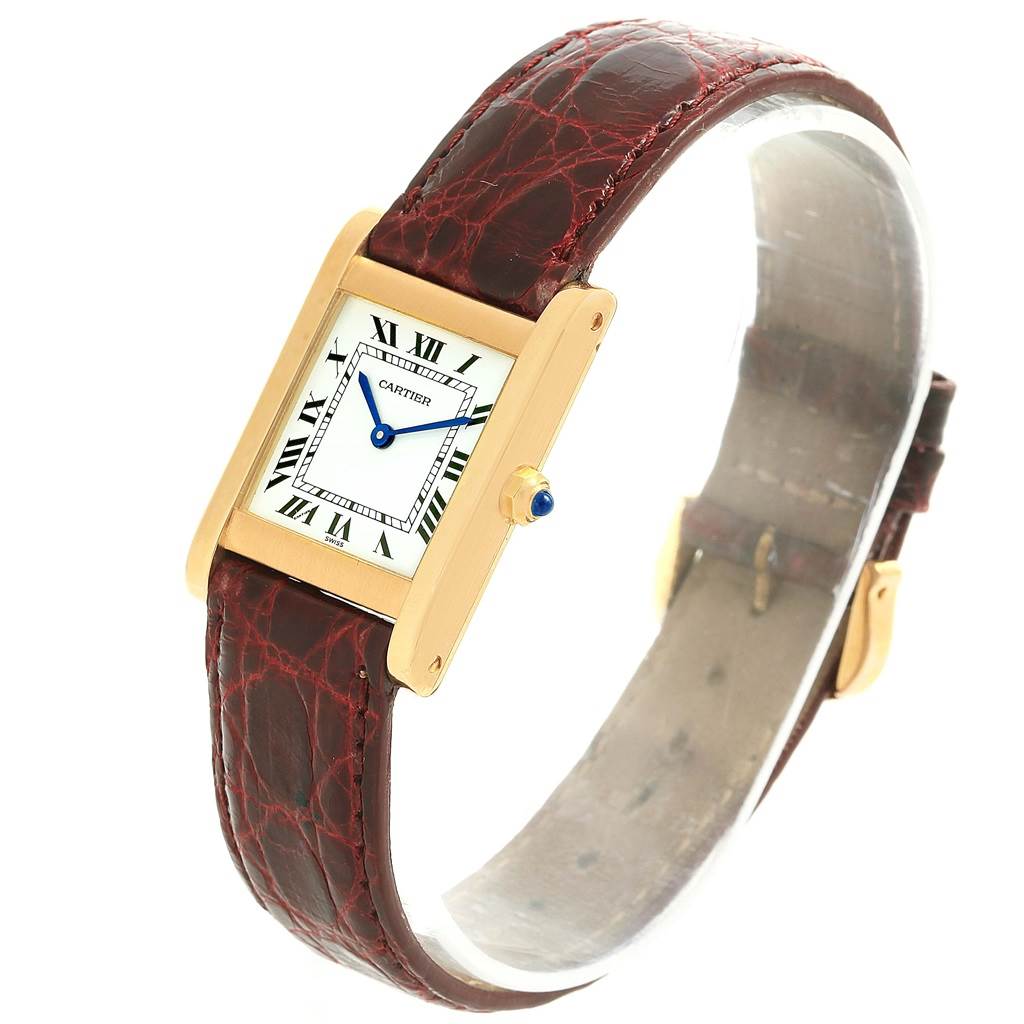 The Cartier Tank Classic Women's Yellow Gold White Dial Women's Yellow Gold White Dial watch is shown at a slight diagonal angle, featuring the face, strap, and crown.