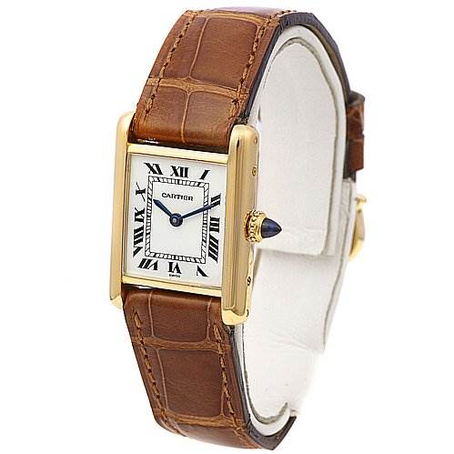 This image shows a Cartier Tank Classic Women's Yellow Gold White Dial Women's Yellow Gold White Dial model watch at an oblique angle, highlighting its face and leather strap.