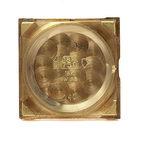 This is the case back of a Cartier Tank Classic Women's Yellow Gold White Dial Women's Yellow Gold White Dial watch, showing the interior with "18K" and "SWISS" markings.