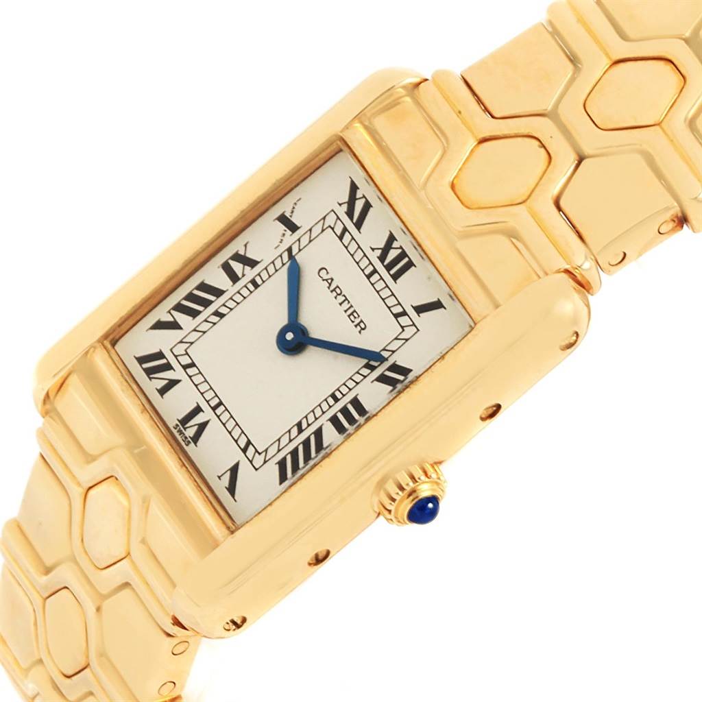 This image shows a Cartier Tank Classic Women's Yellow Gold Silver Dial Women's Yellow Gold Silver Dial watch from an angled top view, highlighting the face, Roman numerals, and part of the band.