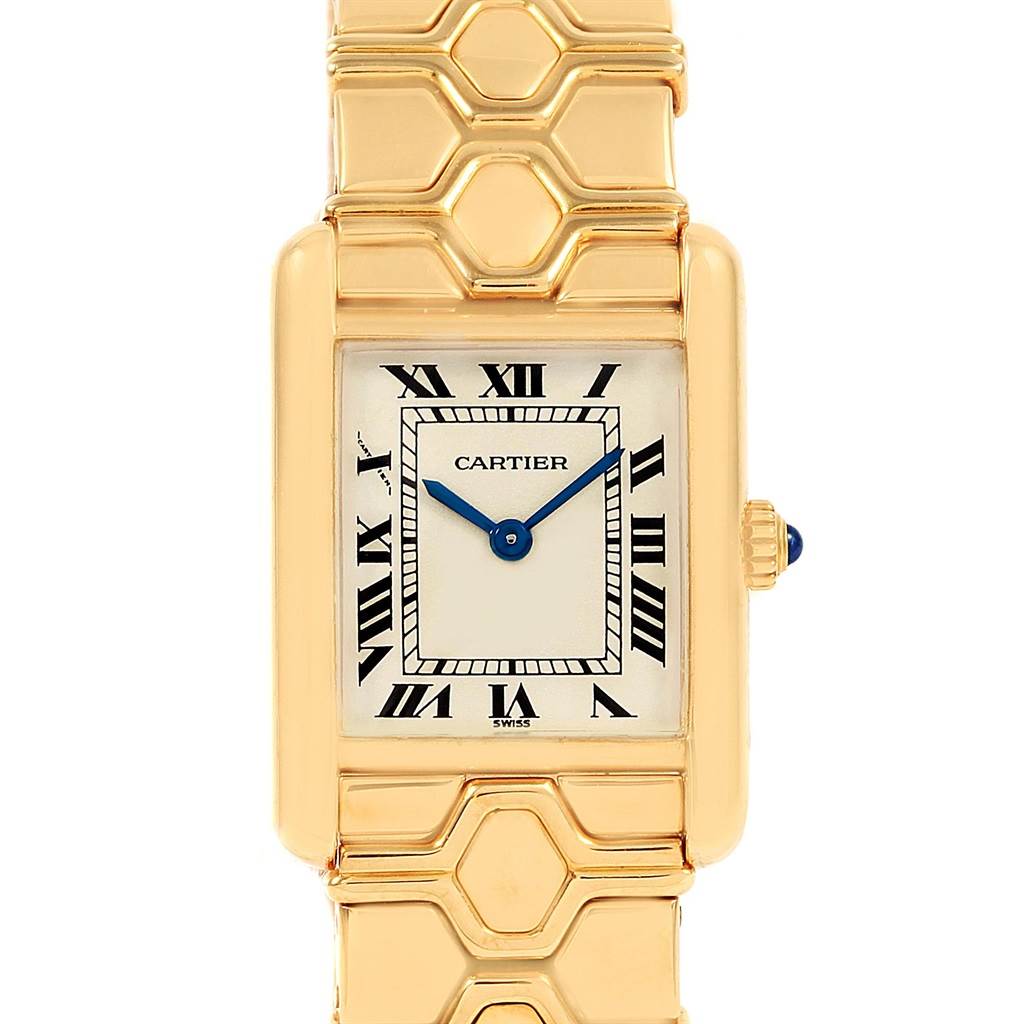 This image shows a front view of the Cartier Tank Classic Women's Yellow Gold Silver Dial Women's Yellow Gold Silver Dial model, featuring its dial, Roman numerals, hands, crown, and part of the bracelet.