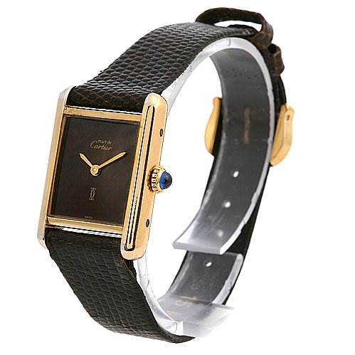 The image shows a side angle of the Tank Classic model by Cartier, highlighting the watch face, crown, and strap.