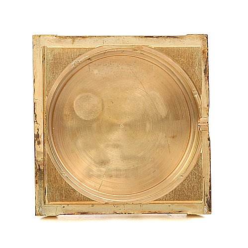 This image shows a close-up of the case back of a Cartier Tank Classic Women's Yellow Gold Brown Dial Women's Yellow Gold Brown Dial watch.