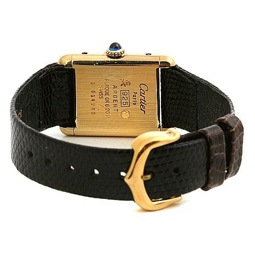 This image shows the back of a Cartier Tank Classic Women's Yellow Gold Brown Dial Women's Yellow Gold Brown Dial watch, including the caseback and leather strap with the buckle.