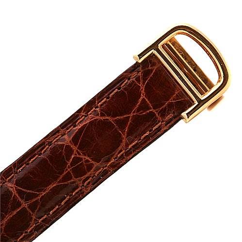 The image shows a close-up of the brown leather strap and gold buckle from a Cartier Tank Classic Women's Yellow Gold White Dial Women's Yellow Gold White Dial watch.