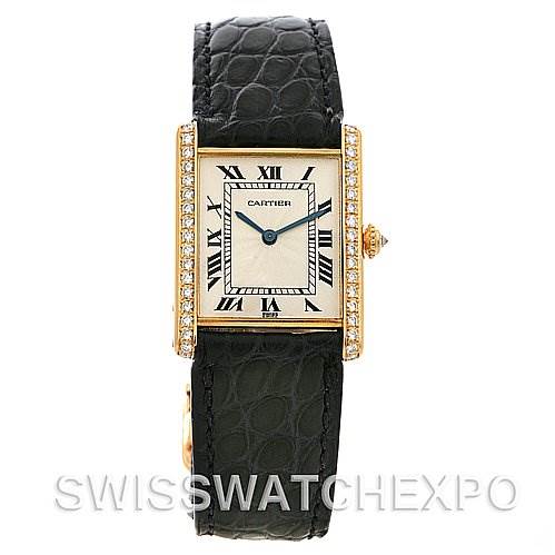 The image shows a frontal view of the Cartier Tank Classic Women's Yellow Gold Silver Dial Women's Yellow Gold Silver Dial watch, highlighting its rectangular face, diamond-encrusted bezel, and black leather strap.