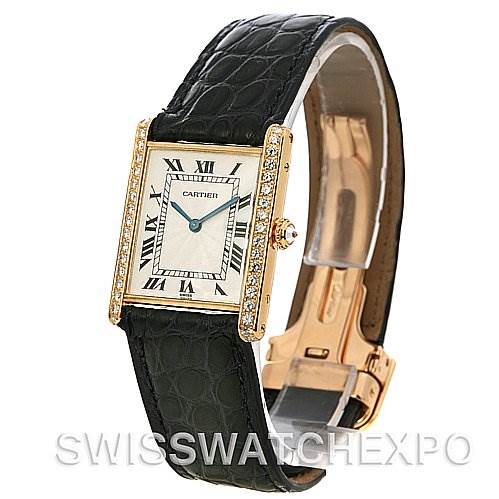 This image shows a Cartier Tank Classic Women's Yellow Gold Silver Dial Women's Yellow Gold Silver Dial watch at an angle highlighting its face, case, strap, and clasp.