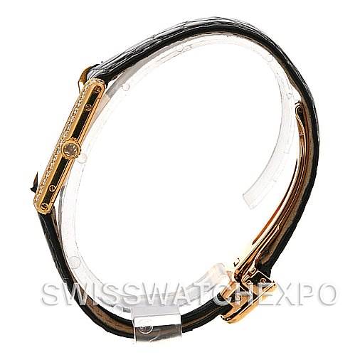 The image shows a side view of the Cartier Tank Classic Women's Yellow Gold Silver Dial Women's Yellow Gold Silver Dial watch, highlighting its strap and case side.